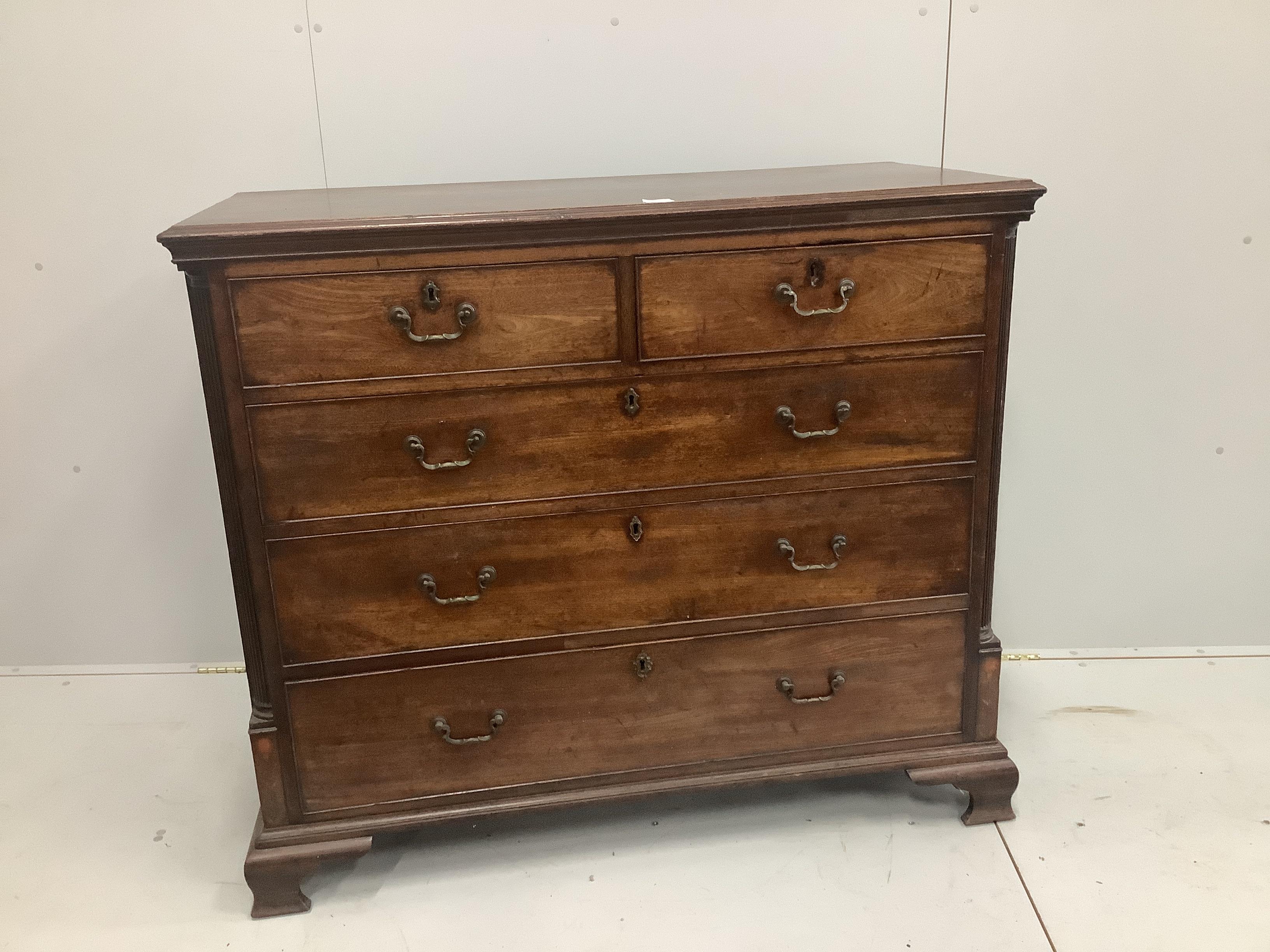 A George III mahogany chest of two short and three long drawers, with fluted pilaster sides, width 127cm, height 106cm